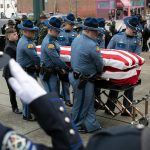 Washington State Trooper Chris Gadd is transported prior to a memorial service in his honor Tuesday, March 12, 2024, at Angel of the Winds Arena in Everett, Washington. (Ryan Berry / The Herald)