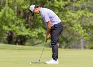 Kamiak’s Tristan Kim putts during the 4A District 1 Boys Golf Championship at Legion Memorial Golf Course on Tuesday, May 13, 2025 in Everett, Washington. (Olivia Vanni / The Herald)