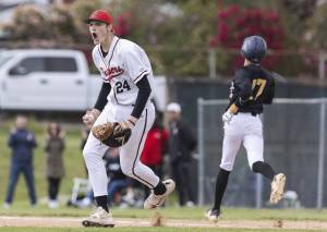 Snohomish’s Luke Davis yells after getting an out at first base during the opening round 3A state game against Bellevue on Tuesday, May 20, 2025 in Snohomish, Washington. (Olivia Vanni / The Herald)