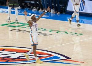 Shai Gilgeous-Alexander celebrates as the Thunder pull away in the fourth quarter Tuesday night in Oklahoma City to beat the Timberwolves. (Carlos Gonzalez / The Minnesota Star Tribune / Tribune News Services)