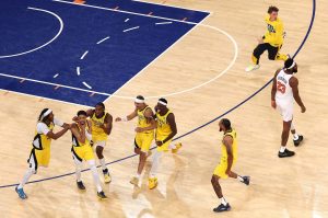 Indiana Pacers guard Tyrese Haliburton (0) is congratulated by his teammates after scoring a game-tying basket against the New York Knicks as time expires in the fourth quarter in Game 1 of the Eastern Conference finals at Madison Square Garden on Wednesday, May 21, 2025, in New York. (Al Bello / Getty Images / Tribune News Services)