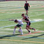 Edmonds-Woodways Alex Plumis wards off Monroes Cody Duncan during a 3A State second-round game on May 23, 2025 at Mercer Island High School. (Qasim Ali / The Herald)