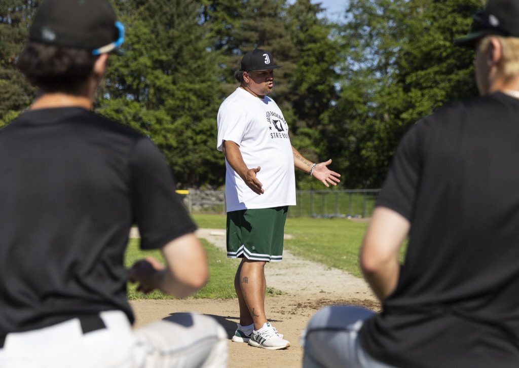 Jackson head coach Joe Fleury talks to his team during practice on Wednesday, May 28, 2025 in Mill Creek, Washington. (Olivia Vanni / The Herald)