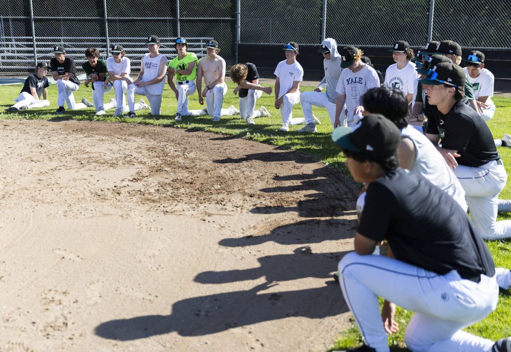Jackson players listen to head coach Joe Fleury during practice on Wednesday, May 28, 2025 in Mill Creek, Washington. (Olivia Vanni / The Herald)