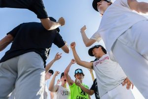 Jackson baseball players cheer before starting their next exercise during practice on Wednesday, May 28, 2025 in Mill Creek, Washington. (Olivia Vanni / The Herald)