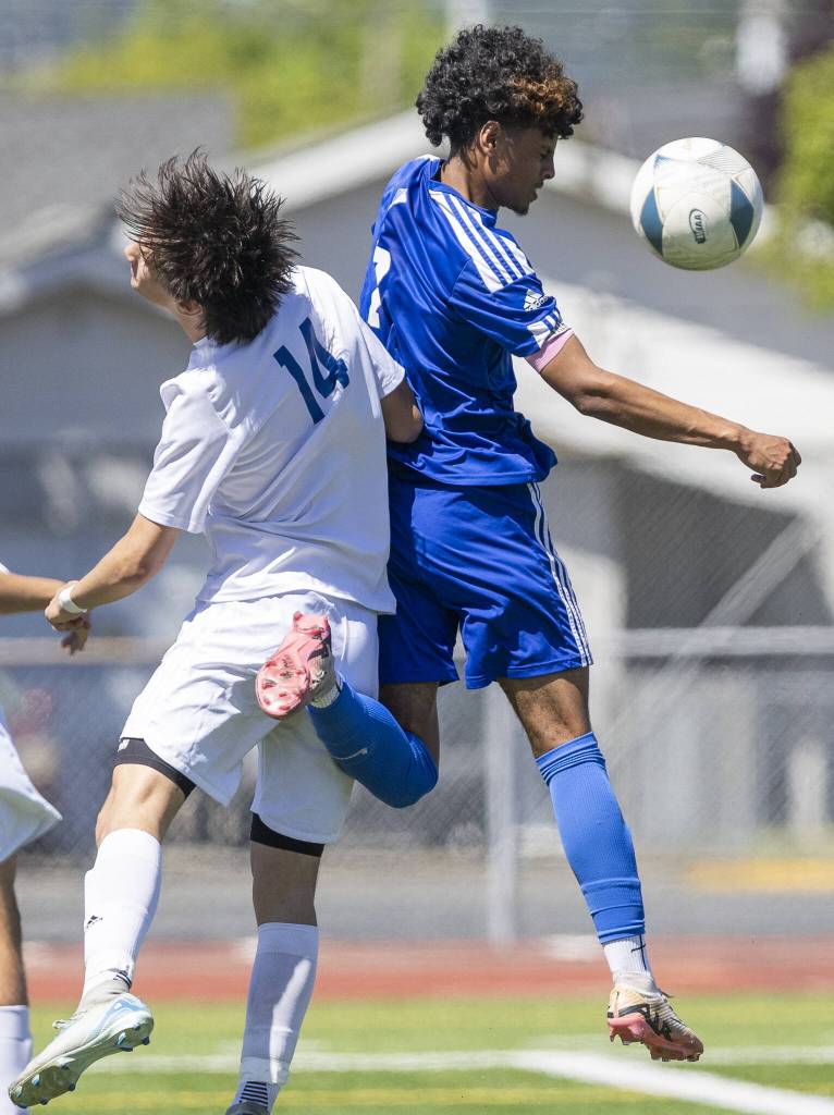 Shorewoods Matthew Bereket leaps in the air to head the ball during the 3A state semifinal game against Ingraham on Friday, May 30, 2025 in Puyallup, Washington. (Olivia Vanni / The Herald)