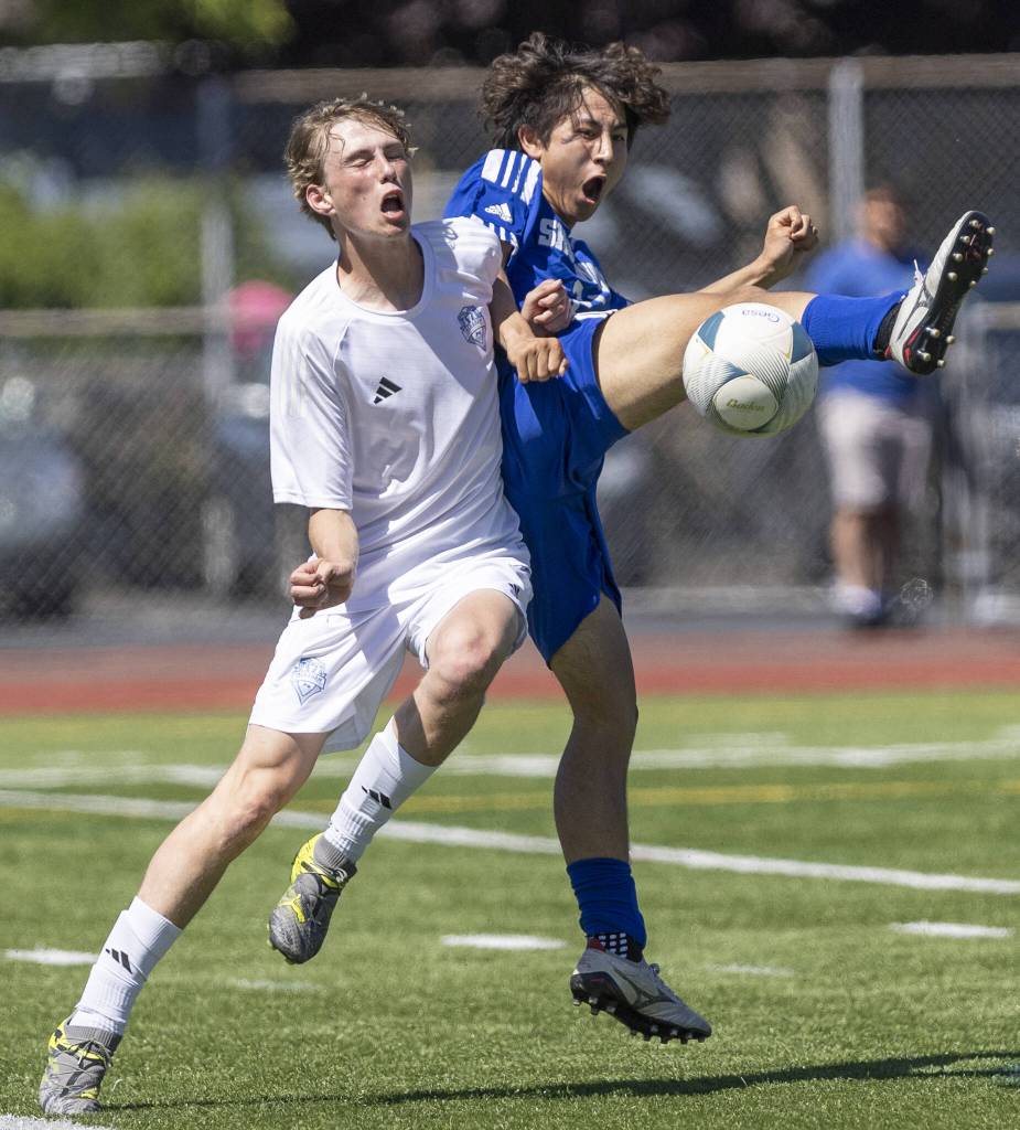 Shorewoods Ian Baxter jumps to try and trap the ball during the 3A state semifinal game against Ingraham on Friday, May 30, 2025 in Puyallup, Washington. (Olivia Vanni / The Herald)