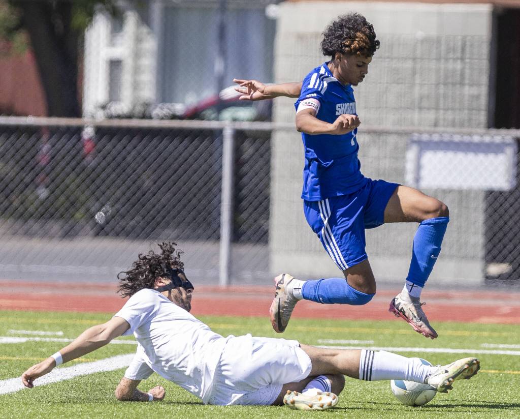 Shorewoods Matthew Bereket leaps over a tackle during the 3A state semifinal game against Ingraham on Friday, May 30, 2025 in Puyallup, Washington. (Olivia Vanni / The Herald)