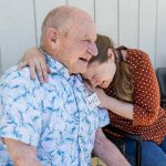 Jennifer Humelo, right, hugs Art Cass outside of Full Life Care Snohomish County on Wednesday, May 28, 2025 in Everett, Washington. (Olivia Vanni / The Herald)