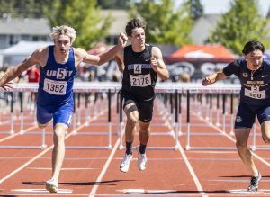 Shorewood’s Jaden Marlow looks to his left as he crosses the finish line in the 3A Boys 110 Hurdles final on Friday, May 30, 2025 in Tacoma, Washington. (Olivia Vanni / The Herald)