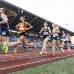 Runners pass by the stands at Mt. Tahoma high school in the 3A girls 3200 meter final on Saturday, May 31, 2025 in Tacoma, Washington. (Olivia Vanni / The Herald)