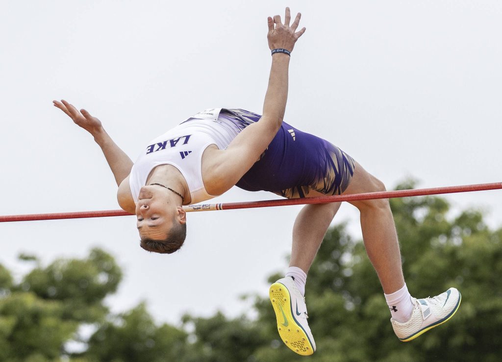 Lake Stevens Teegan Lawson maneuvers over the pole in the 4A boys high jump final on Saturday, May 31, 2025 in Tacoma, Washington. (Olivia Vanni / The Herald)
