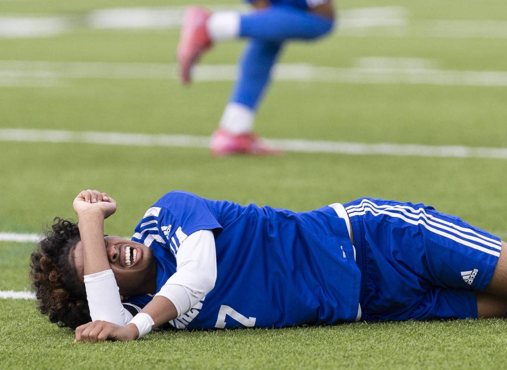 Shorewoods Matthew Bereket lies on the ground after being fouled during the 3A state championship game against Mercer Island on Saturday, May 31, 2025 in Puyallup, Washington. (Olivia Vanni / The Herald)