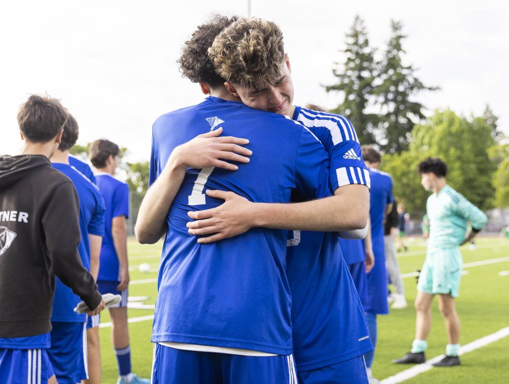 Shorewoods Niki Genadiev hugs teammate Matthew Bereket after the 3A state championship game against Mercer Island on Saturday, May 31, 2025 in Puyallup, Washington. (Olivia Vanni / The Herald)