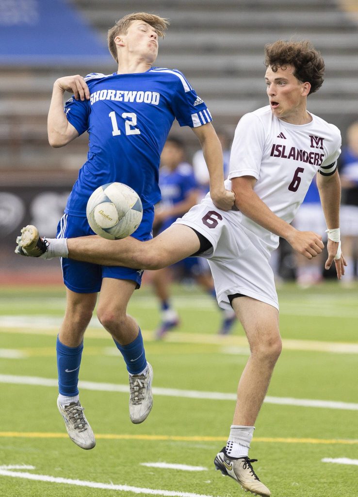 Shorewoods Bobby Lamb jumps to try and trap the ball during the 3A state championship game against Mercer Island on Saturday, May 31, 2025 in Puyallup, Washington. (Olivia Vanni / The Herald)