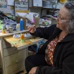 Sue Traher paints a wooden egg as an example for those who will be taking the crafts class offered at the Good Cheer Thrift Store in Langley. (Olivia Vanni / The Herald)