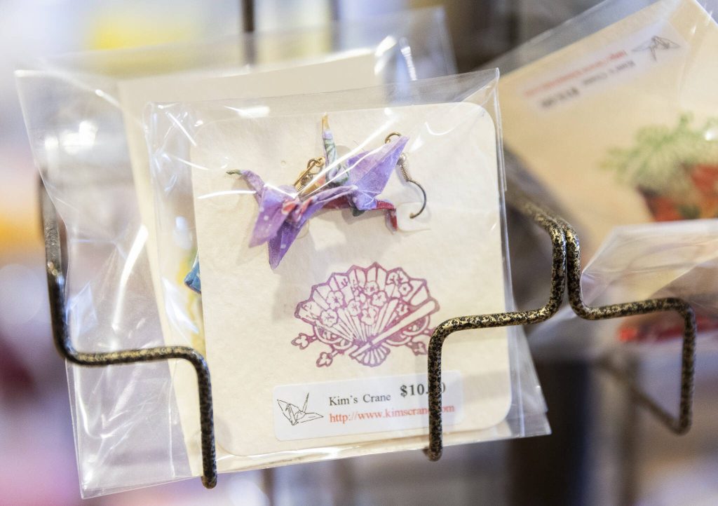 Small origami crane earrings for sale at the Kims Crane at-home showroom.