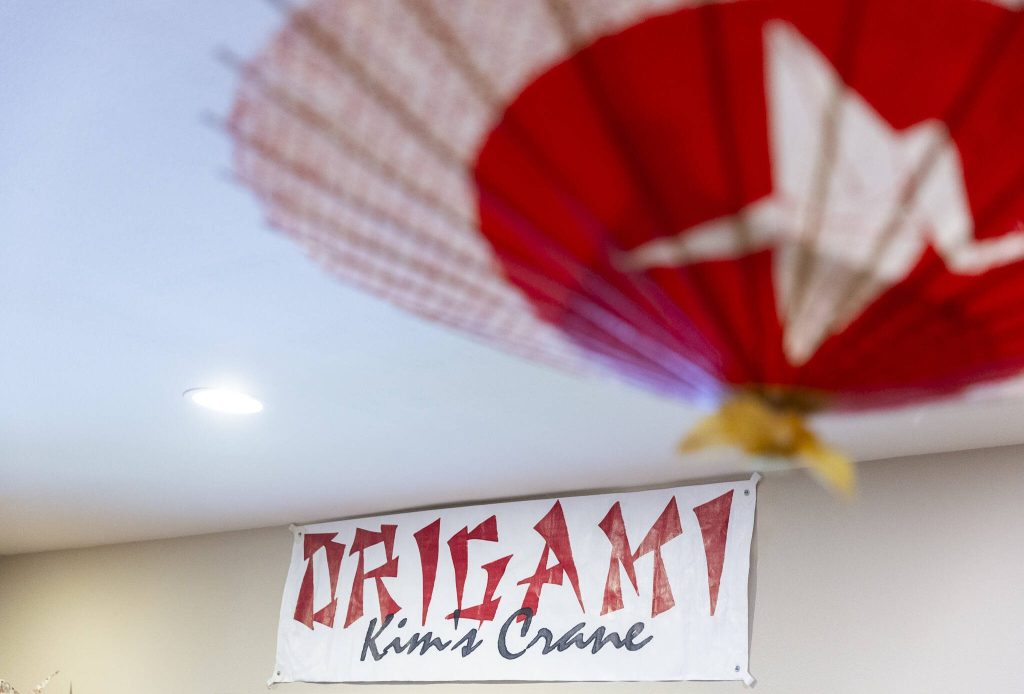 A Kims Crane sign hangs on the wall inside the showroom on Monday, Feb. 17, 2025, in Snohomish, Washington. (Olivia Vanni / The Herald)