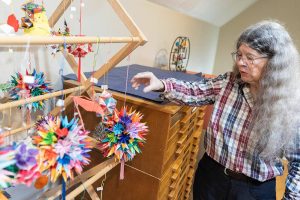 Kim Crane talks about a handful of origami items on display inside her showroom on Monday, Feb. 17, 2025, in Snohomish, Washington. (Olivia Vanni / The Herald)