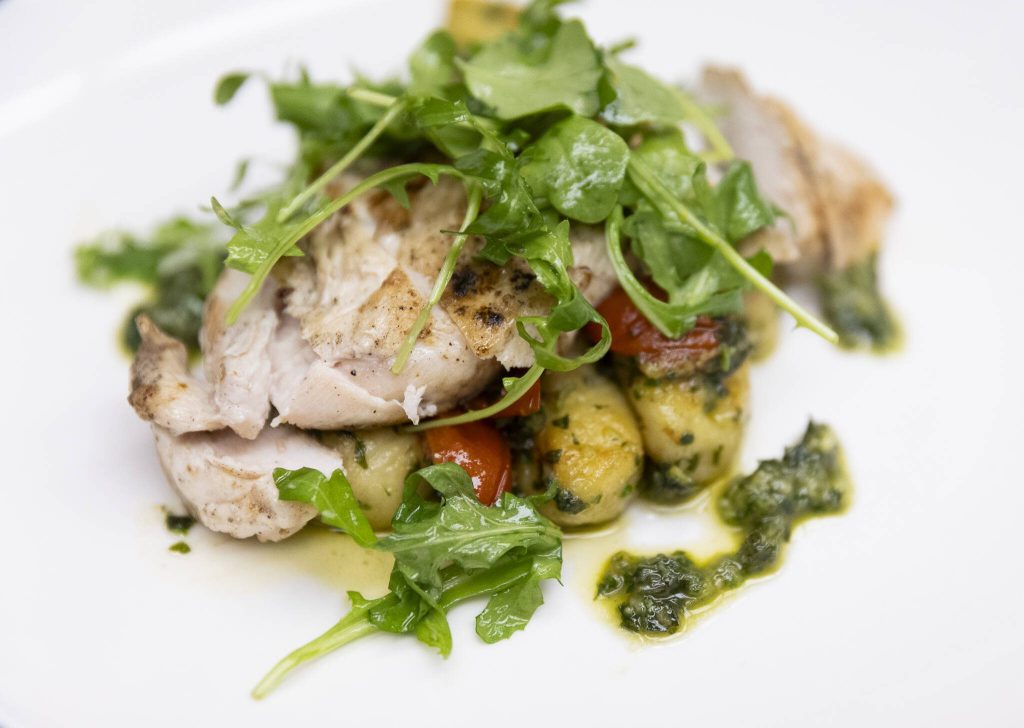 Pesto gnocchi with grilled chicken, tomato, parmesan and arugula salad at the Edmonds College Cafe on Thursday, May 29, 2025 in Lynnwood, Washington. (Olivia Vanni / The Herald)