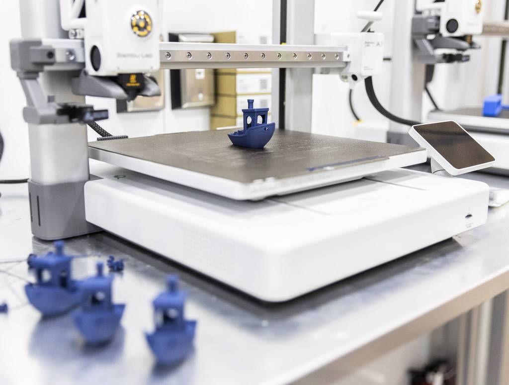 A 3D printer prints a boat at the new Boeing machinists unions apprentice training center on Friday, June 6, 2025 in Everett, Washington. (Olivia Vanni / The Herald)