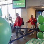 Chance Tuttle and father Rob Tuttle are some of the first passengers off of the first Frontier Airlines flight arriving at Paine Field Airport on Monday, June 2, 2025 in Everett, Washington. (Olivia Vanni / The Herald)
