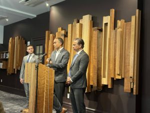 Attorney General Nick Brown, center, speaks to reporters alongside California Attorney General Rob Bonta, right, and Oregon Attorney General Dan Rayfield, left, before an event at Town Hall Seattle on Monday, June 2, 2025. (Photo by Jake Goldstein-Street/Washington State Standard)