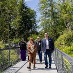 Lynnwood Mayor Christine Frizzell and Lynnwood City Council Member David Parshall along with others involved in the renovation of Scriber Lake Park explore the new boardwalk on Wednesday, June 4, 2025 in Lynnwood, Washington. (Olivia Vanni / The Herald)