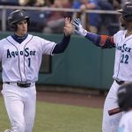 Everett AquaSox infielder Colt Emerson gets a high-five from teammate Lazaro Montes after scoring during the game against the Tri-City Dust Devils on Tuesday, May 6, 2025 in Everett, Washington. (Olivia Vanni / The Herald)