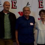 The late Chet Hovdes son, Ryan (left), and wife Joan (right), pose with EvCC Hall of Famer Larry Walker at the Everett Community College Athletics 2025 Hall of Fame Induction Ceremony in Everett, Washington on June 5, 2025. Chet Hovde won 442 games in 33 years as the womens basketball head coach at EvCC. (Joe Pohoryles / The Herald)
