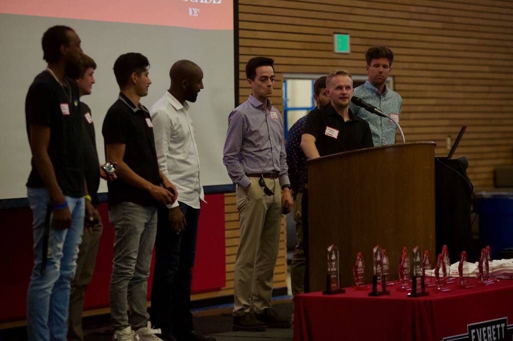 Mason Nicol speaks in front of the rest of his 2013 cross country teammates at the Everett Community College Athletics 2025 Hall of Fame Induction Ceremony in Everett, Washington on June 5, 2025. The 2013 EvCC mens cross country team won the NWAC Championship and was inducted into the Hall of Fame as a team. (Joe Pohoryles / The Herald)