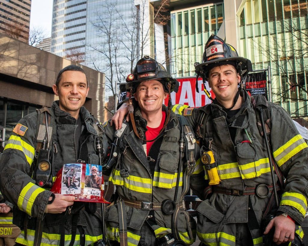 Everett Firefighters (from left to right) Andy Denzel, Galen Wallace and climb team captain Mike Dunmire prepare to climb the Columbia Tower staircase in Seattle during the Leukemia & Lymphoma Society Firefighter Stairclimb on March 9, 2025. (Photo courtesy of Steve Baer / FireDogPhotos)