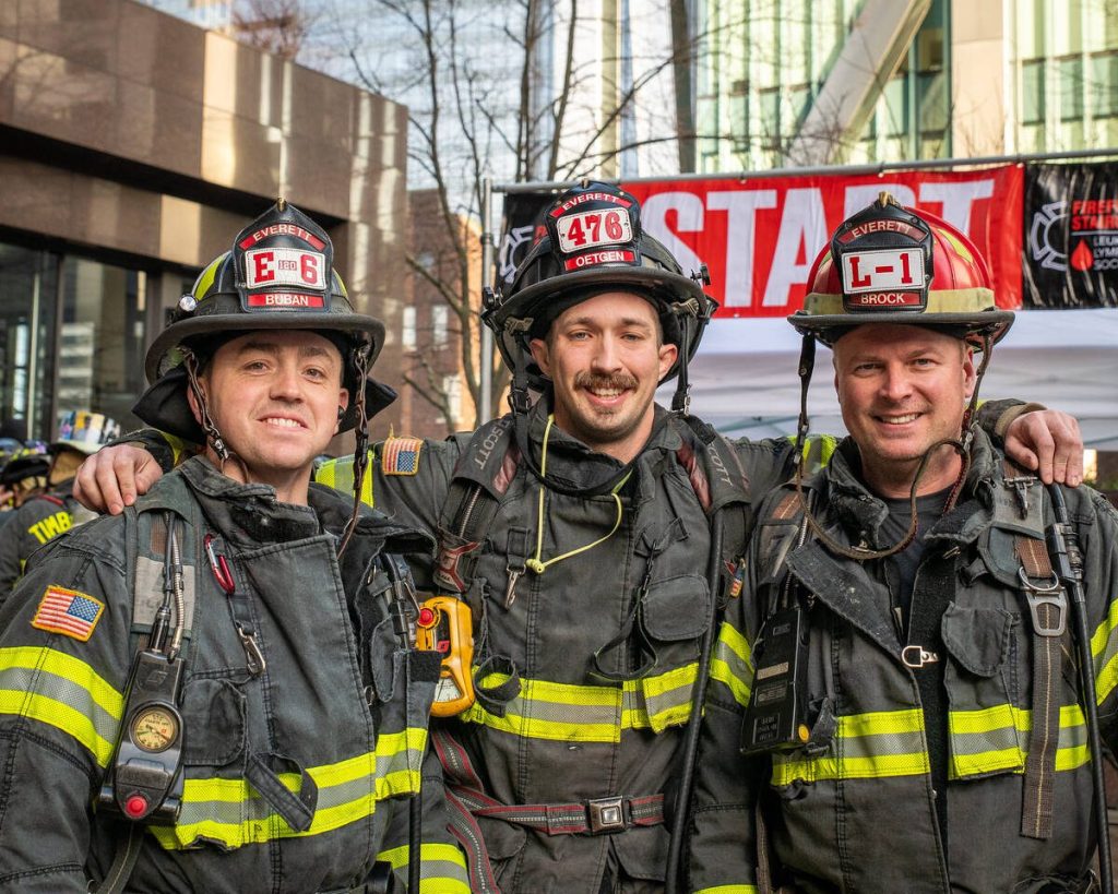 Everett firefighters (from left to right) John Bubane, Drew Oetgen and Jason Brock prepare to climb the Columbia Tower staircase in Seattle during the Leukemia & Lymphoma Society Firefighter Stairclimb on March 9, 2025. (Photo courtesy of Steve Baer / FireDogPhotos)