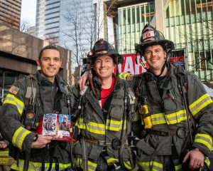 Everett Firefighters (from left to right) Andy Denzel, Galen Wallace and climb team captain Mike Dunmire prepare to climb the Columbia Tower staircase in Seattle during the Leukemia & Lymphoma Society Firefighter Stairclimb on March 9, 2025. (Photo courtesy of Steve Baer / FireDogPhotos)
