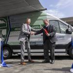 Snohomish County Health Department Director Dennis Worsham and Snohomish County Executive Dave Somers shake hands after cutting the ribbon during the unveiling of the health departments Health on Wheels Van, a mobile public health unit, on Wednesday, April 9, 2025 in Everett, Washington. (Olivia Vanni / The Herald)