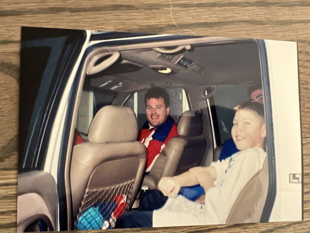 A photograph captures Mike Murphy and a young TJ Oshie (right) in a car (c. 1997-1998) (Photo courtesy of Mike Murphy)