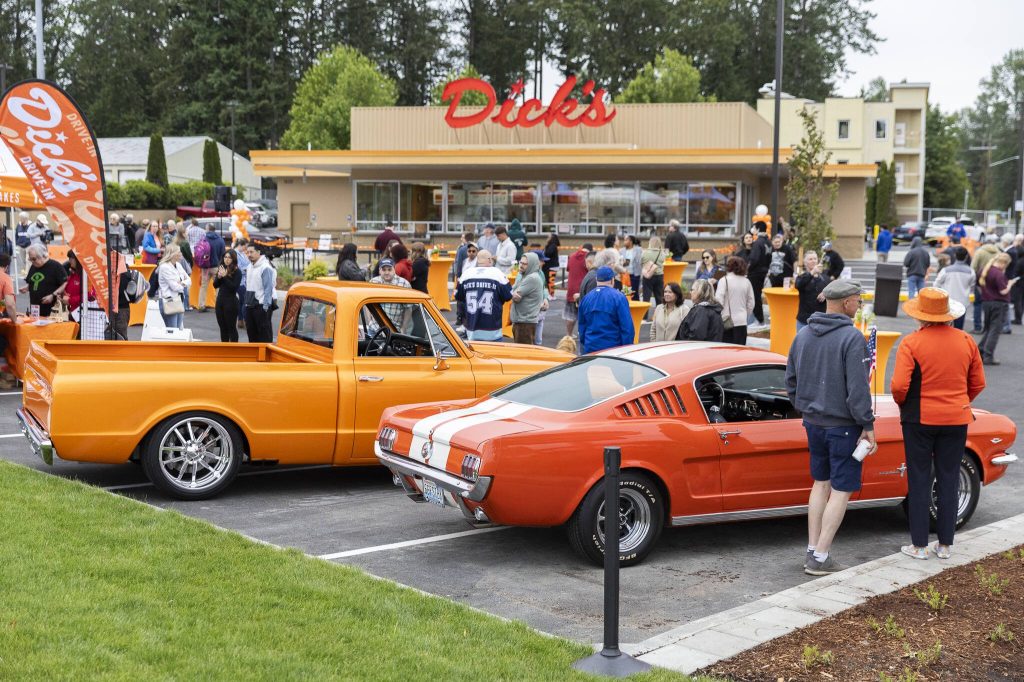 People gather for the grand opening of the new Everett location of Dicks Drive-In on Thursday, June 12, 2025 in Everett, Washington. (Olivia Vanni / The Herald)
