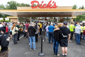 Hundreds wait in line to order after the grand opening of Dick’s Drive-In’s new location in Everett on Thursday, June 12, 2025 in Everett, Washington. (Olivia Vanni / The Herald)