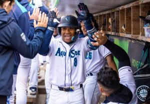 Everett AquaSox infielder Michael Arroyo receives high-fives in the dugout during Everett's 8-1 win against Tri-City at Funko Field in Everett, Washington on June 13, 2025. The 20-year-old Colombia native had two home runs and a career-high six RBI. (Shari Sommerfeld / Everett AquaSox)