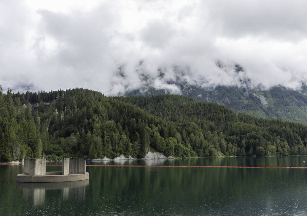 A rain cloud rolls in above Spada Lake on Wednesday in Granite Falls. (Olivia Vanni / The Herald)