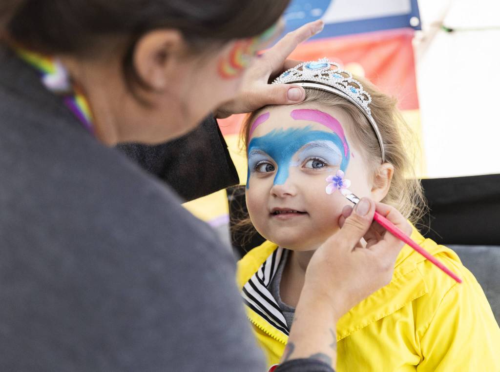 Freya Rhode, 4, gets her face painted during the Everett Pride Block Party on Saturday, June 21, 2025 in Everett, Washington. (Olivia Vanni / The Herald)