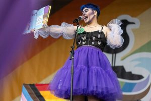 Mx. Kenbie reads ‘My Shadow is Purple’ during the Everett Pride Block Party on Saturday, June 21, 2025 in Everett, Washington. (Olivia Vanni / The Herald)
