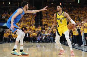 The Indiana Pacers' Tyrese Haliburton (0) works against the Oklahoma City Thunder's Chet Holmgren during the first quarter in Game 4 of the NBA Finals at Gainbridge Fieldhouse on Friday, June 13, 2025, in Indianapolis. (Maddie Meyer / Getty Images / Tribune News Services)