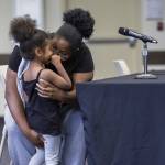 Aleena Richie talks with her daughter AMylah, 4, before she addresses the Everett Community College Board during a meeting on Thursday, June 26, 2025 in Everett, Washington. (Olivia Vanni / The Herald)