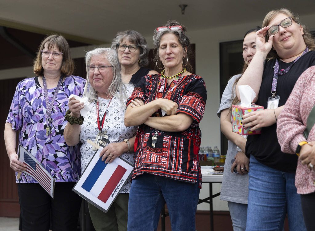 Early Learning Center teachers and staff become emotional as people thank them for their time and dedication on Wednesday, June 25, 2025 in Everett, Washington. (Olivia Vanni / The Herald)