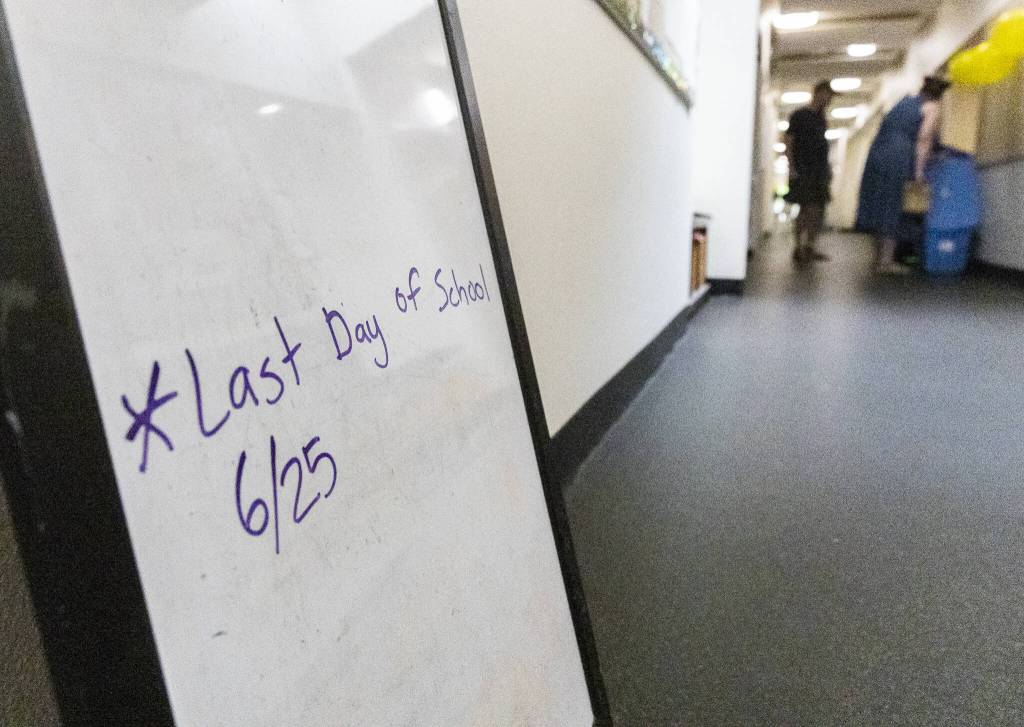 A sign announcing the last day of school sits in the hallway as people pack up on Wednesday, June 25, 2025 in Everett, Washington. (Olivia Vanni / The Herald)