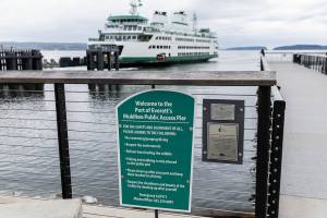 A sign alerting people to “no swimming/jumping/diving” hangs off to the left of the pier on Thursday, June 26, 2025 in Mukilteo, Washington. (Olivia Vanni / The Herald)