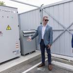 Electric Era Chief Revenue Officer Kyler Schmitz talks to Commerce Director Joe Nguyễn about their battery on Tuesday, June 24, 2025 in Arlington, Washington. (Olivia Vanni / The Herald)