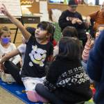 Ruth Zavala, 7, talks through a prompt on the board with a partner during dual language class at Emerson Elementary School on Thursday, Jan. 30, 2025 in Everett, Washington. (Olivia Vanni / The Herald)