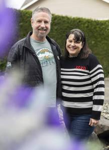 Snohomish County Dahlia Society members Doug Symonds and Alysia Obina on Monday, March 3, 2025 in Lake Stevens, Washington. (Olivia Vanni / The Herald)